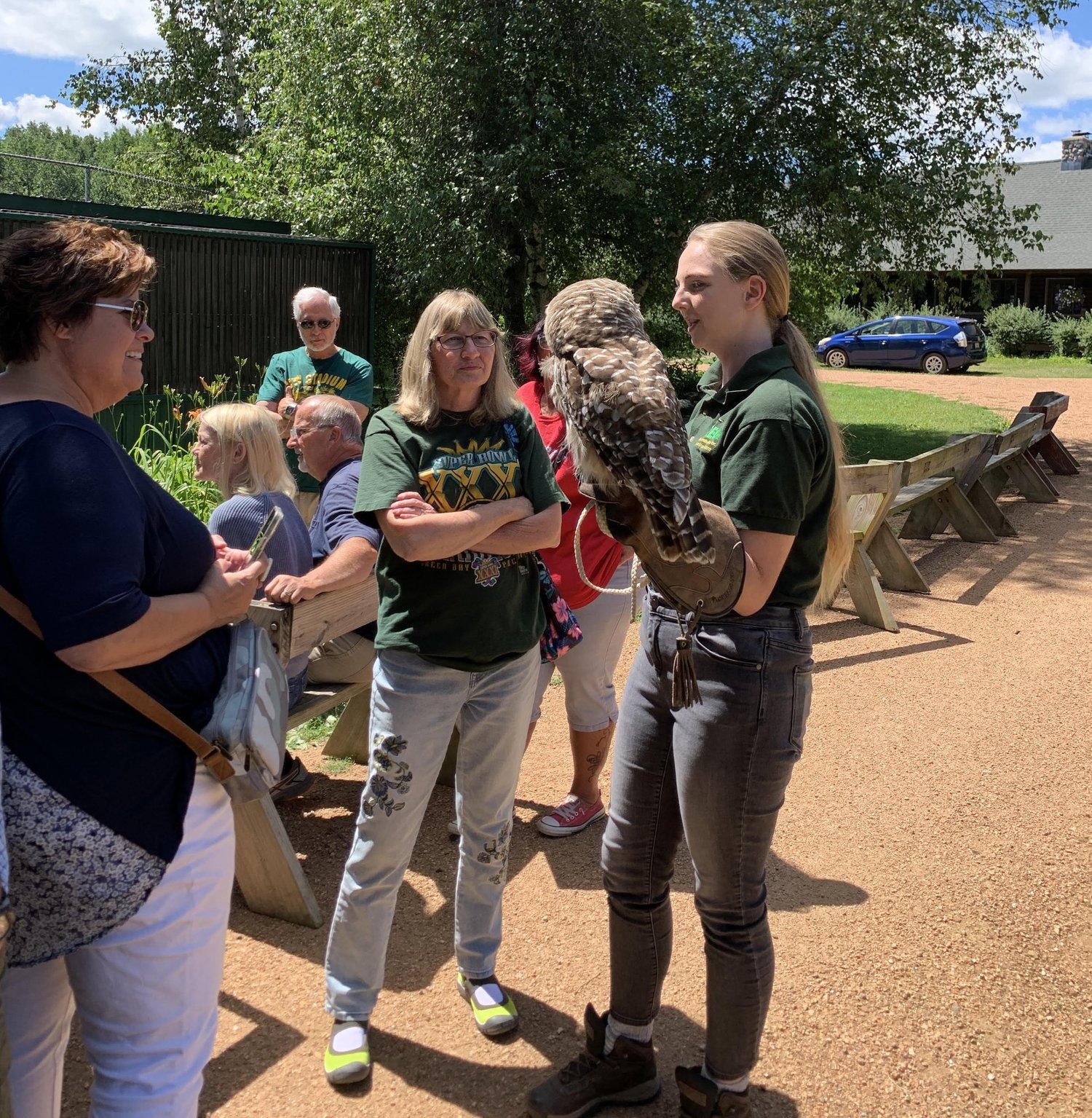 Visitors meeting an owl during a REGI raptor tour